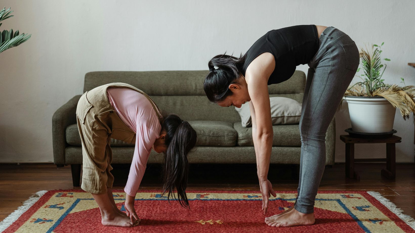 Mother and daughter exercising
