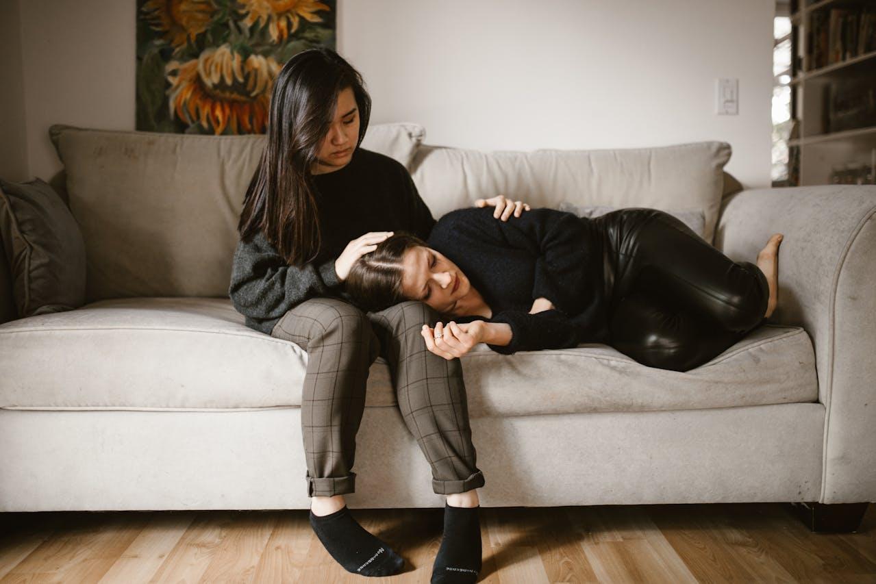 Teen daughter comforting her mother.