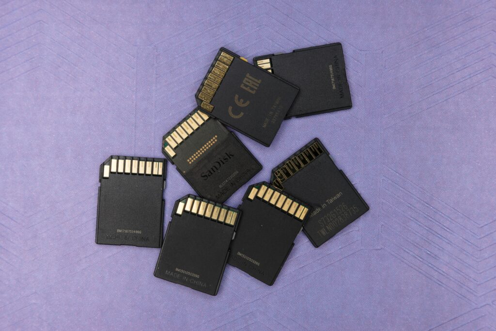 A Stack of used SD memory cards representing fragile digital storage.