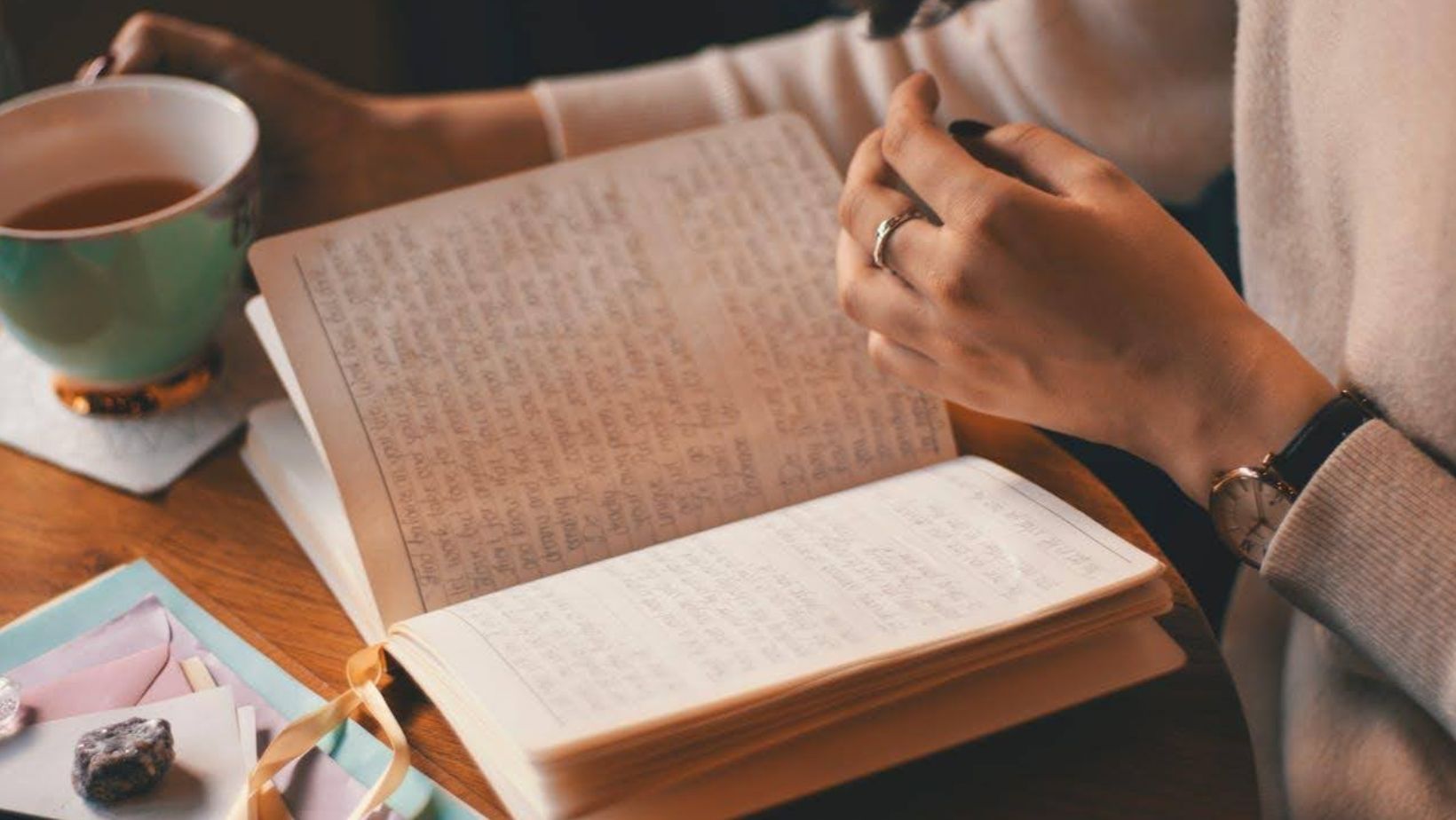 Woman sitting in front of a notebook.
